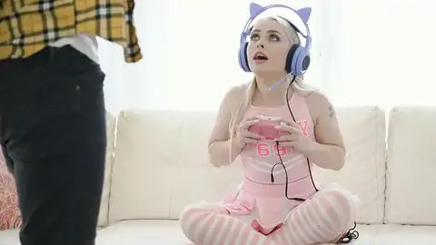 Cosplaying Blonde Wearing Headphones While Gaming